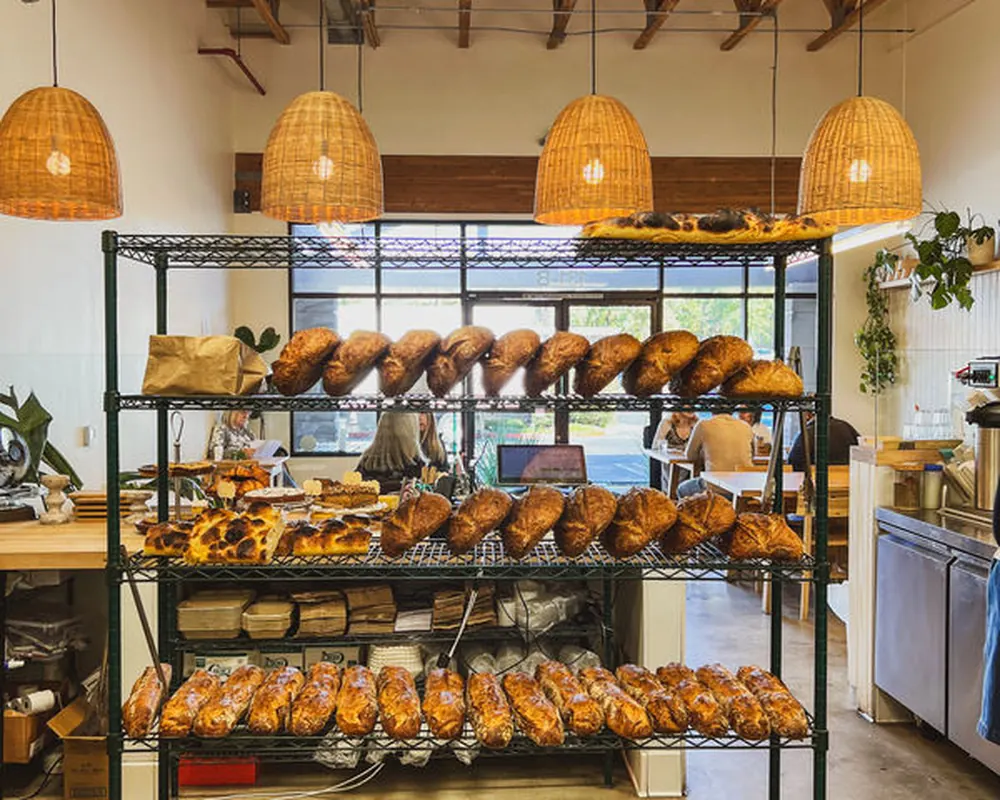 Bread rack filled with fresh loaves at Baker's Daughters bakery in Simi Valley